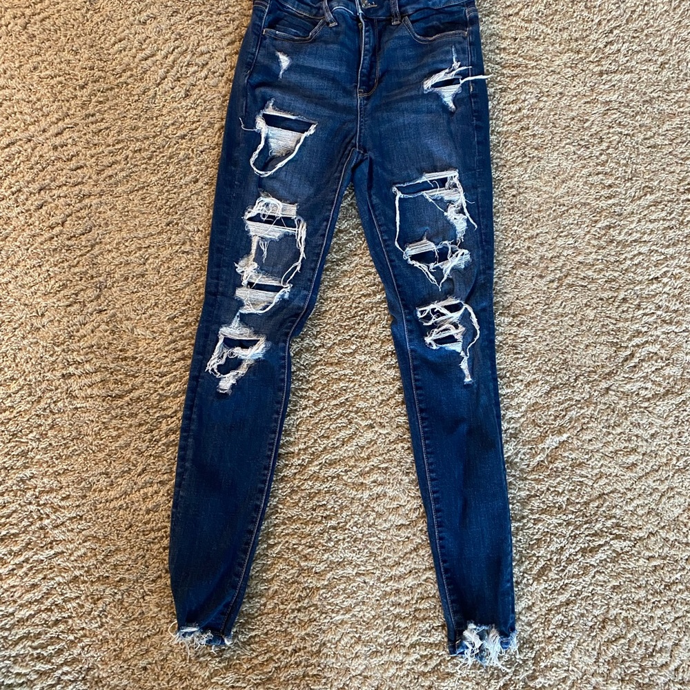 American Eagle Jeans size 4 short. Has fabric under the tears 4 modesty. L new.
